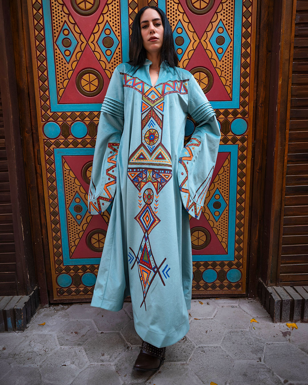 Nubian inspired Motifs on Velvet Dress with Pleated Sleeves.