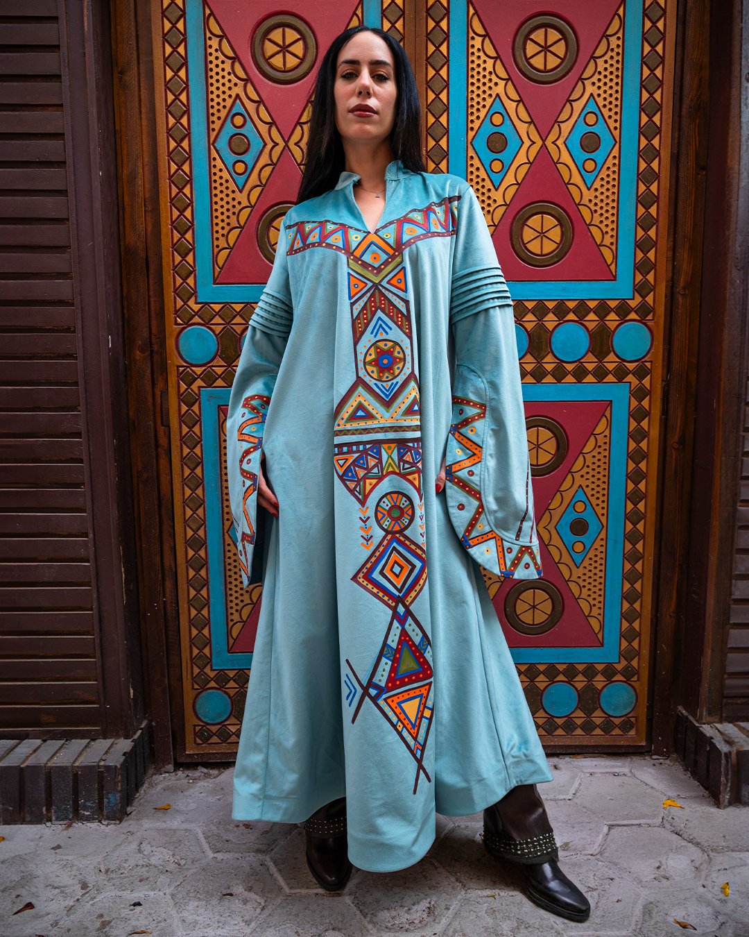 Nubian inspired Motifs on Velvet Dress with Pleated Sleeves.
