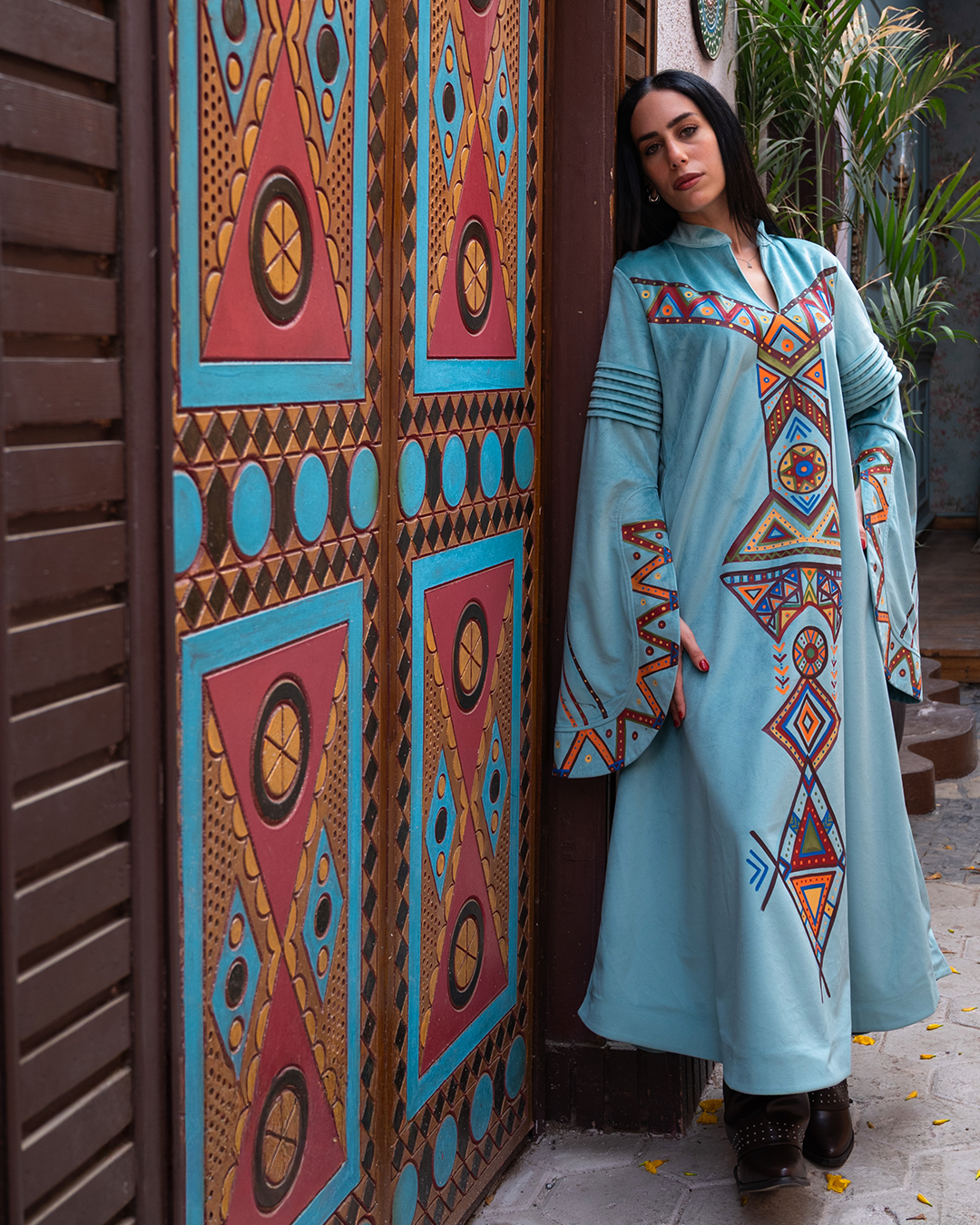 Nubian inspired Motifs on Velvet Dress with Pleated Sleeves.