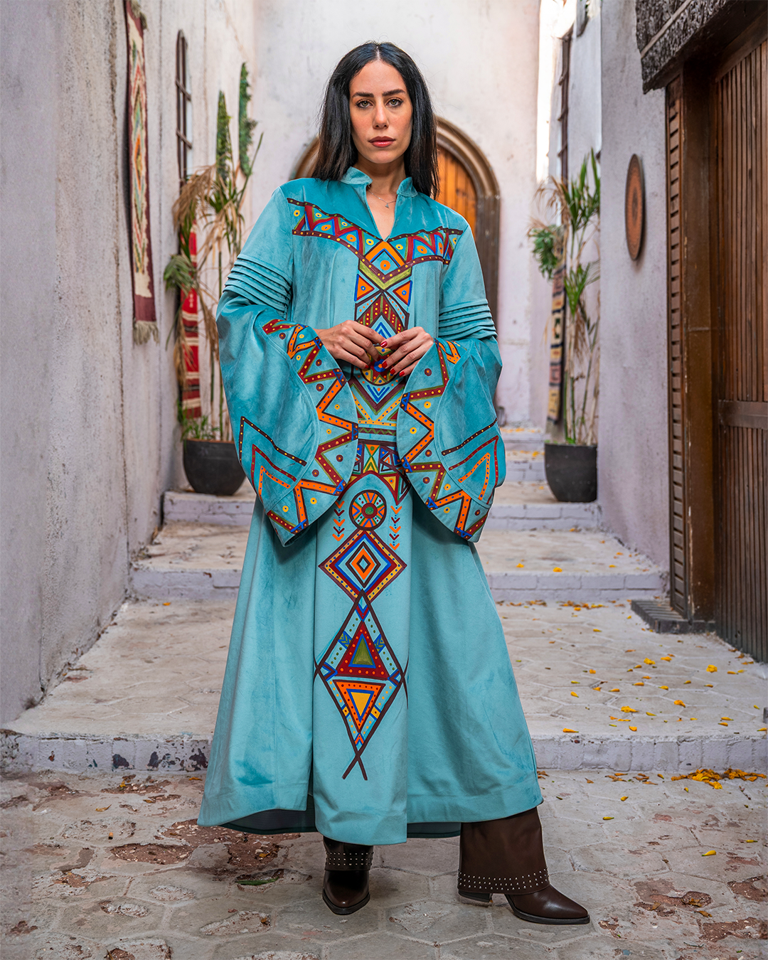 Nubian inspired Motifs on Velvet Dress with Pleated Sleeves.