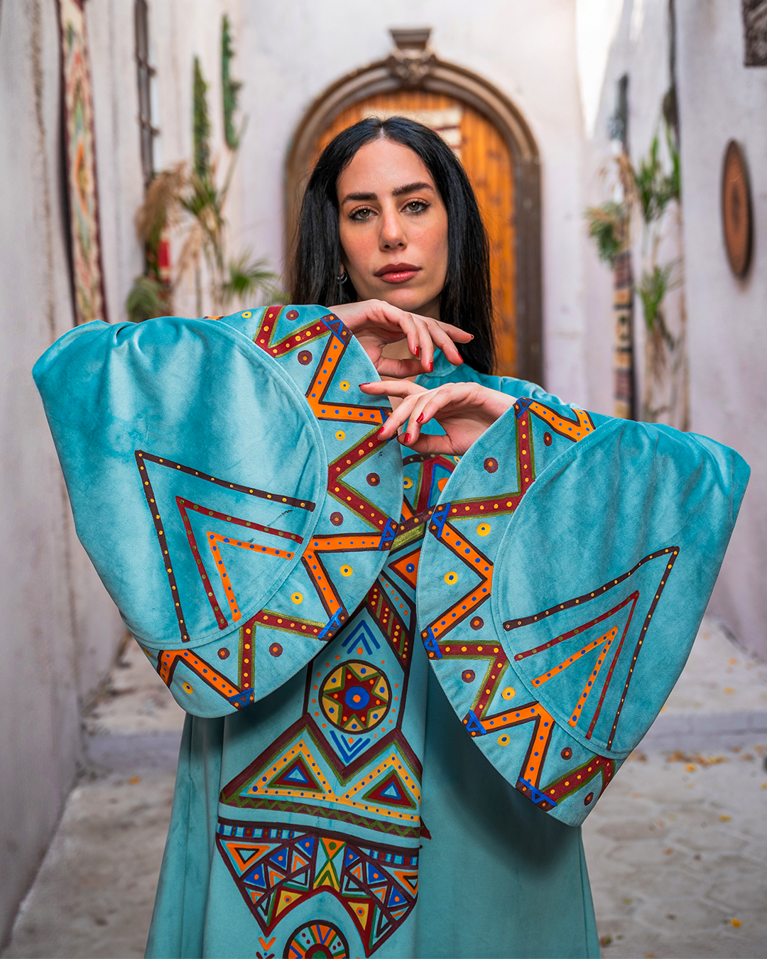 Nubian inspired Motifs on Velvet Dress with Pleated Sleeves.