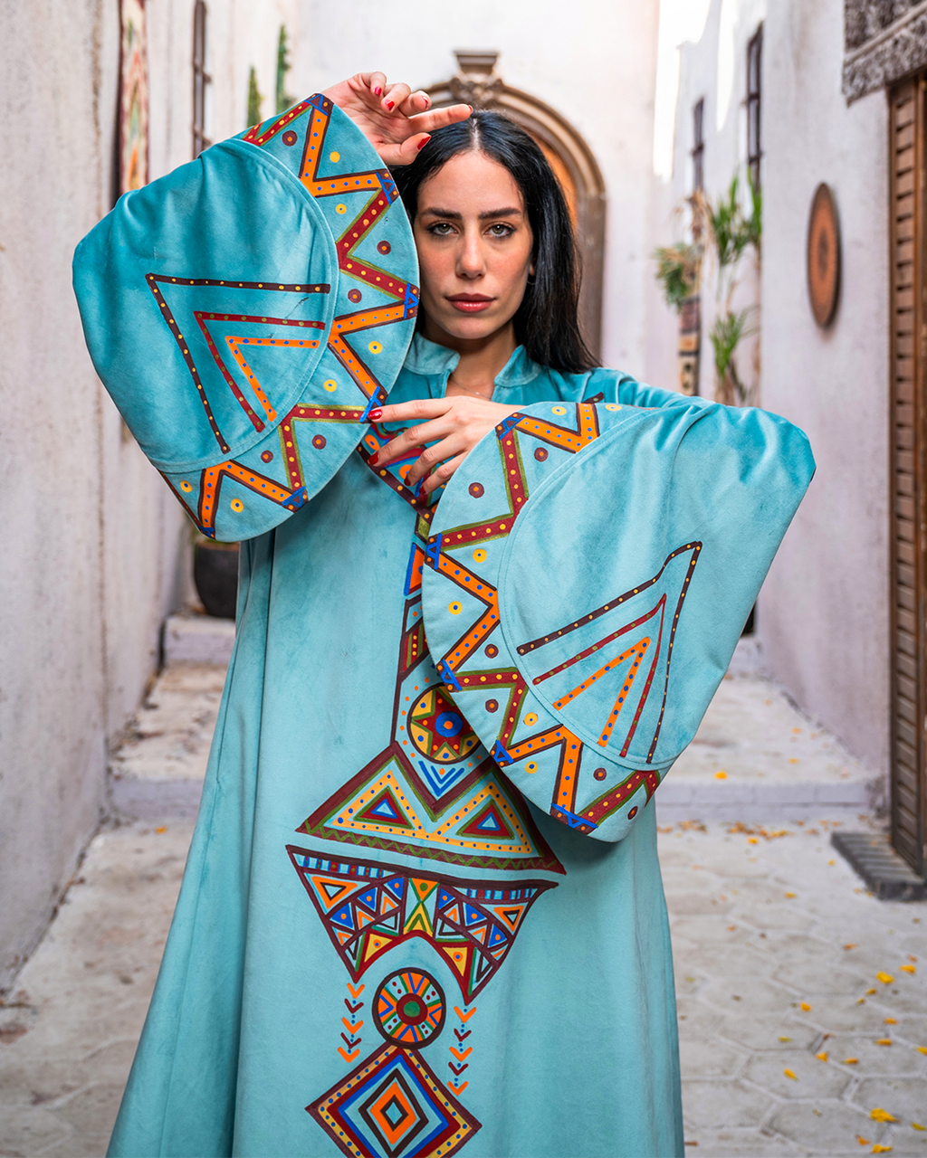 Nubian inspired Motifs on Velvet Dress with Pleated Sleeves.