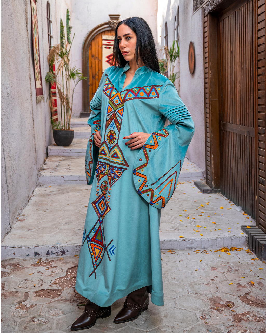 Nubian inspired Motifs on Velvet Dress with Pleated Sleeves.