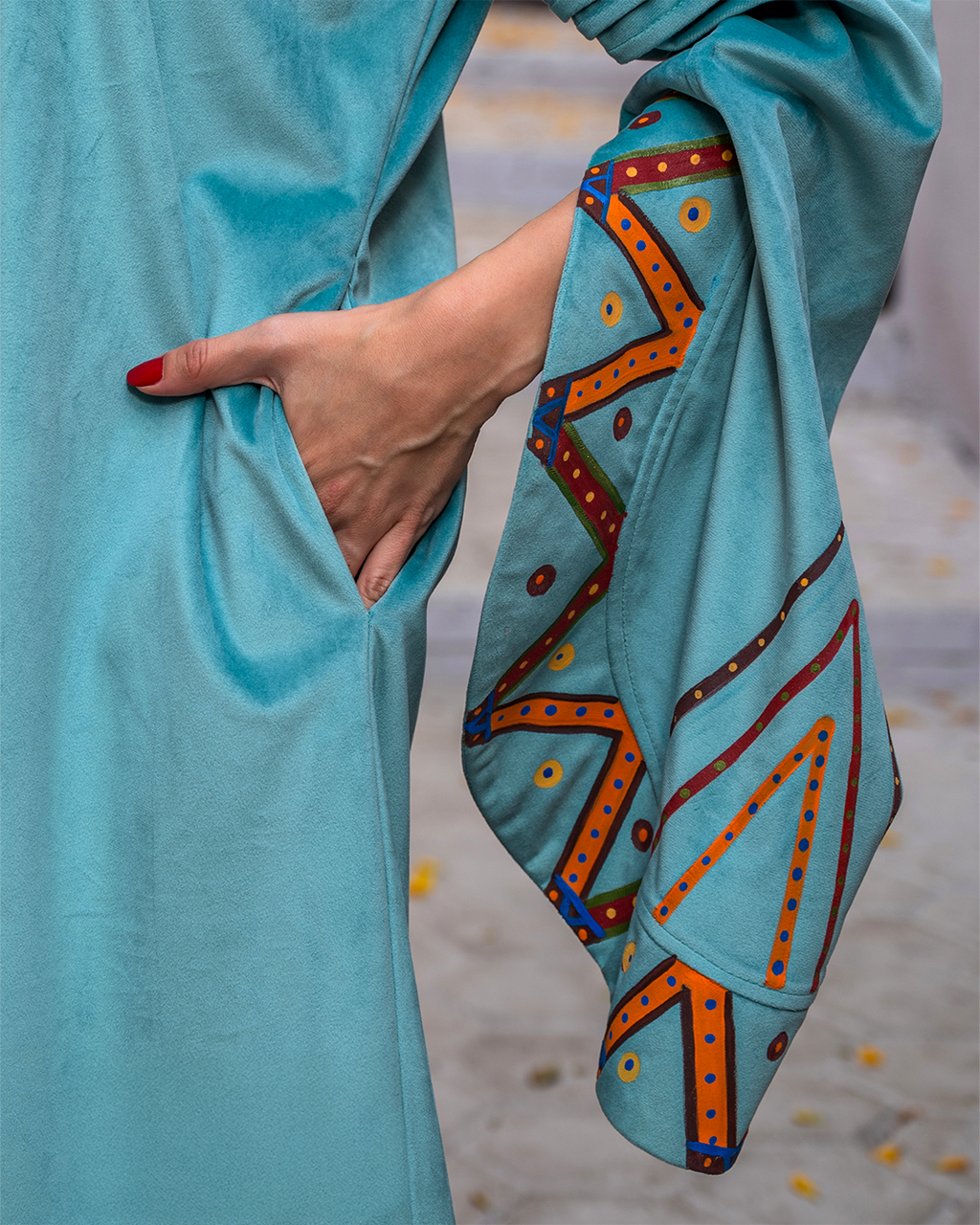 Nubian inspired Motifs on Velvet Dress with Pleated Sleeves.